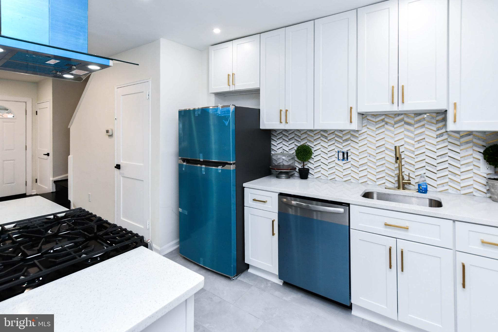 4227 Nash Street Southeast Washington, DC 20020 - Photo 5 of 13 a kitchen with white cabinets and white appliances