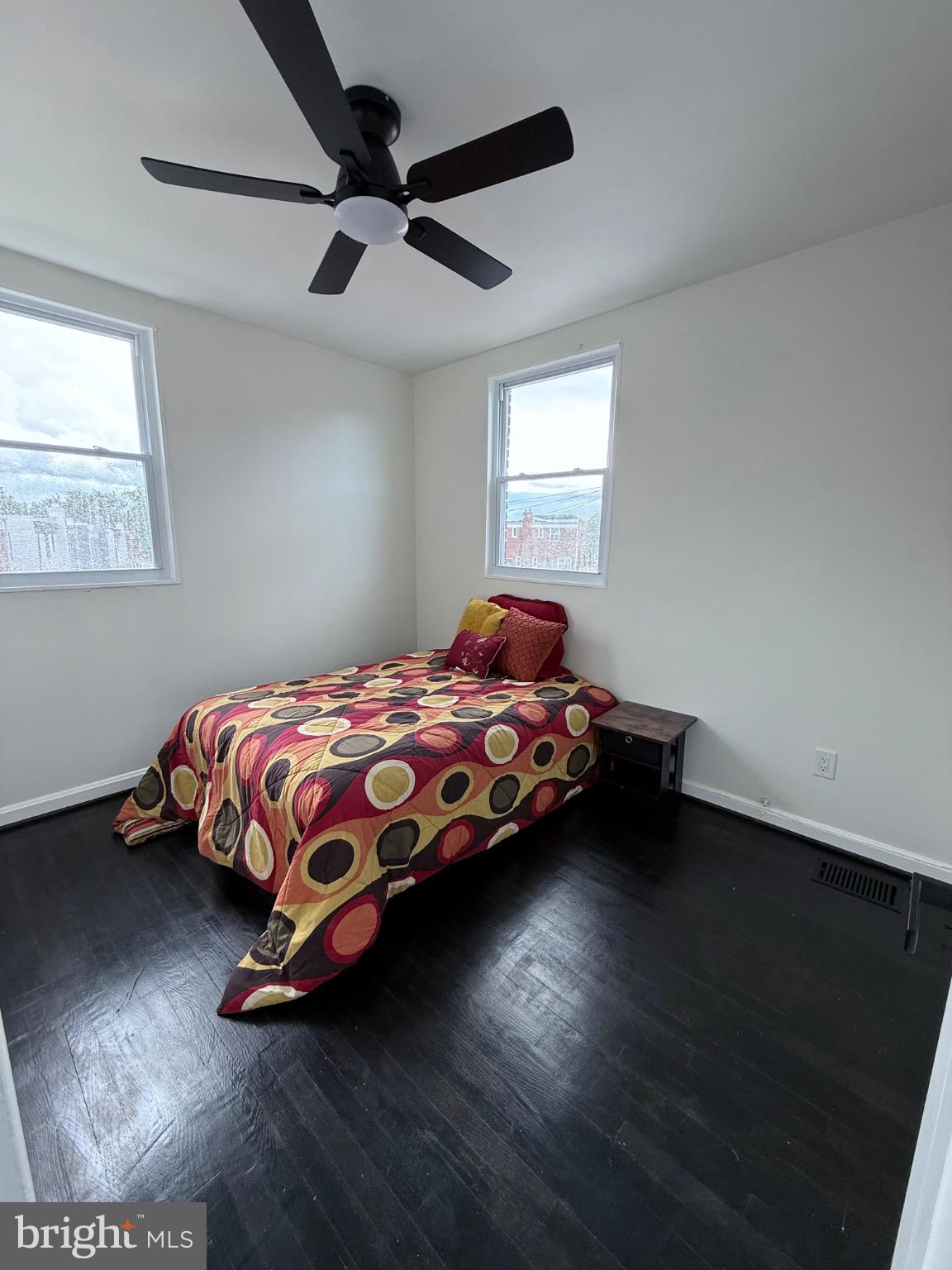 4227 Nash Street Southeast Washington, DC 20020 - Photo 6 of 13 a bedroom with a bed and a ceiling fan