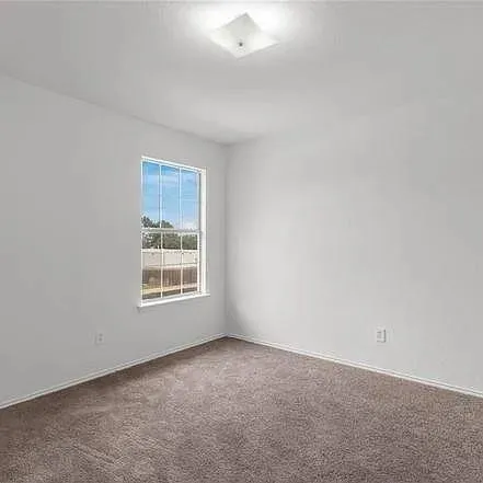 a view of a room that has a window in it