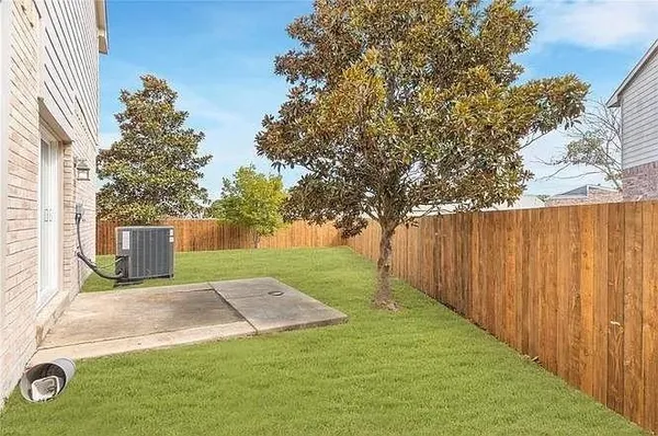 a view of a backyard with large trees