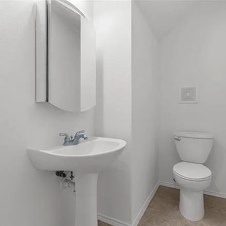 1908 Nest Place Plano, TX 75075 - Photo 8 of 14 a bathroom with a sink toilet and a mirror
