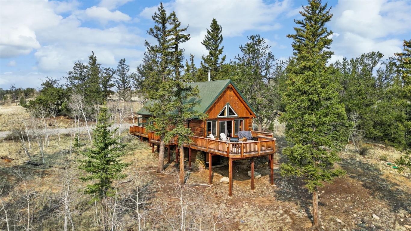 245 Bronco Circle Como, CO 80456 - Photo 1 of 40 a front view of a house with a yard