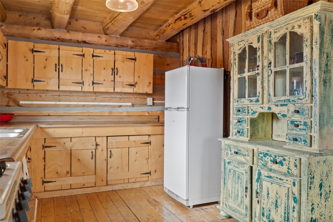 245 Bronco Circle Como, CO 80456 - Photo 14 of 40 a kitchen with windows and refrigerator