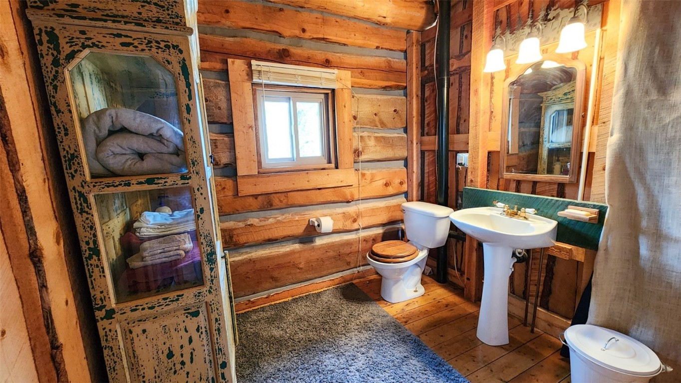 245 Bronco Circle Como, CO 80456 - Photo 17 of 40 a bathroom with a toilet sink and mirror