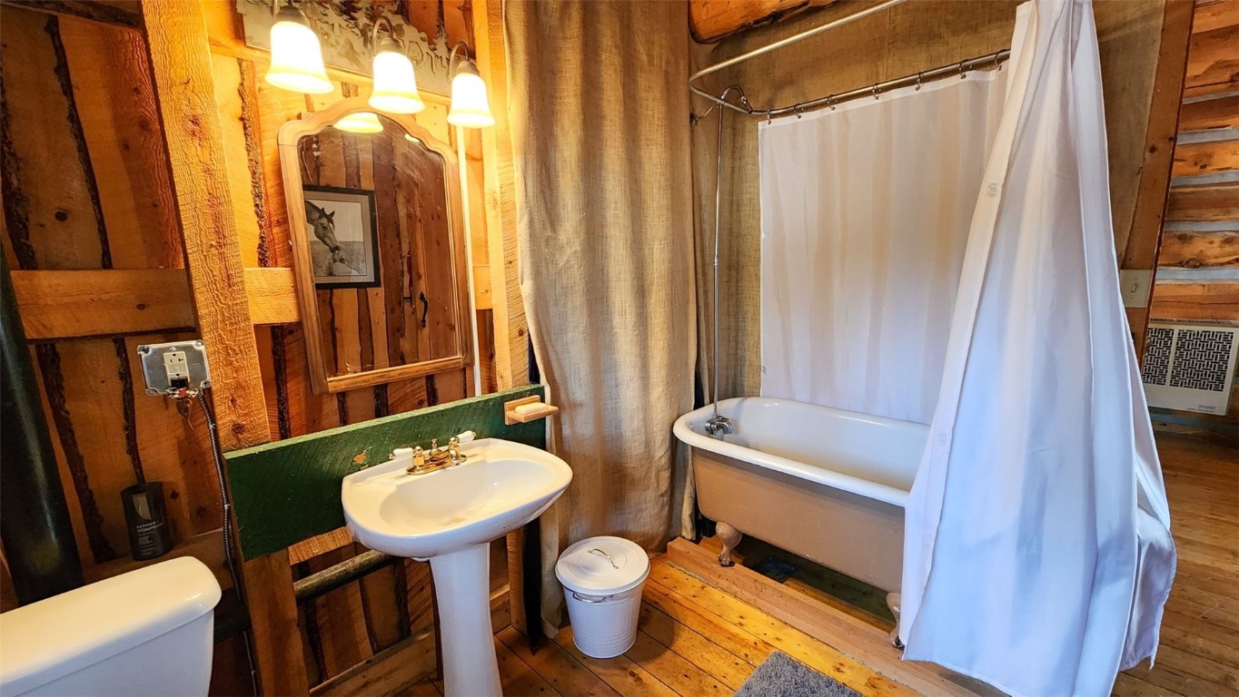 245 Bronco Circle Como, CO 80456 - Photo 18 of 40 a bathroom with a sink toilet and mirror