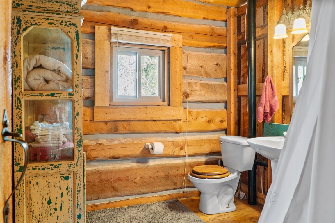 245 Bronco Circle Como, CO 80456 - Photo 19 of 40 a bathroom with a toilet a sink and a shower