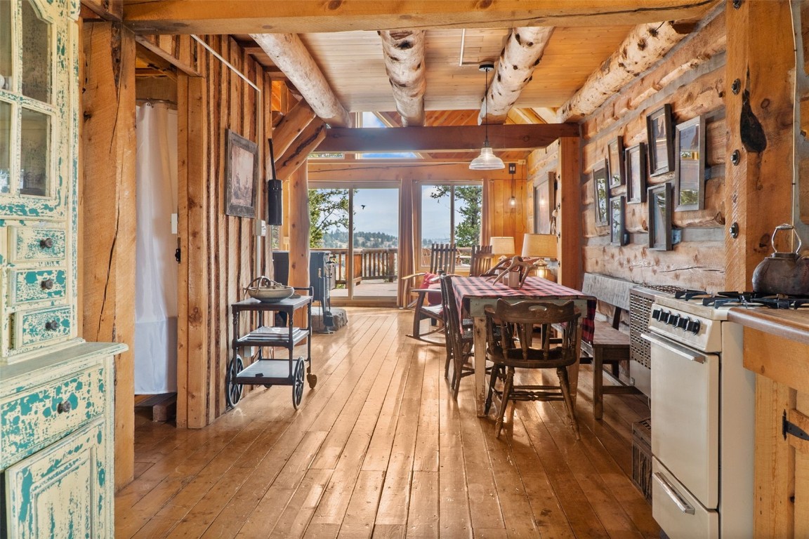 245 Bronco Circle Como, CO 80456 - Photo 25 of 40 a view of a dining room with furniture and wooden floor