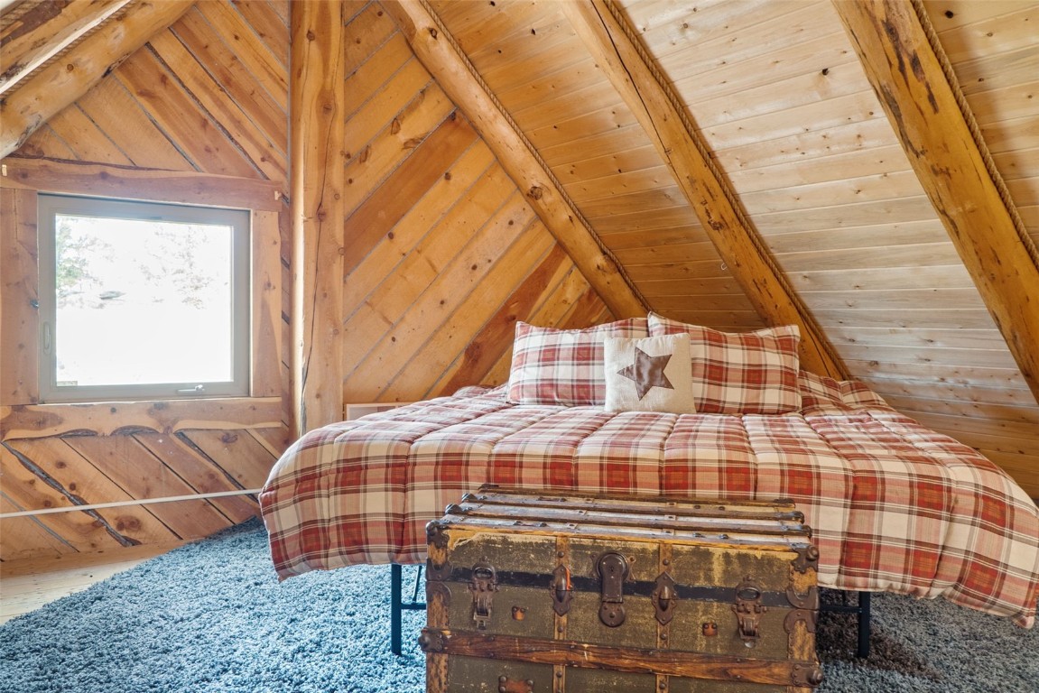 245 Bronco Circle Como, CO 80456 - Photo 29 of 40 a view of a balcony with a rug and wooden floor