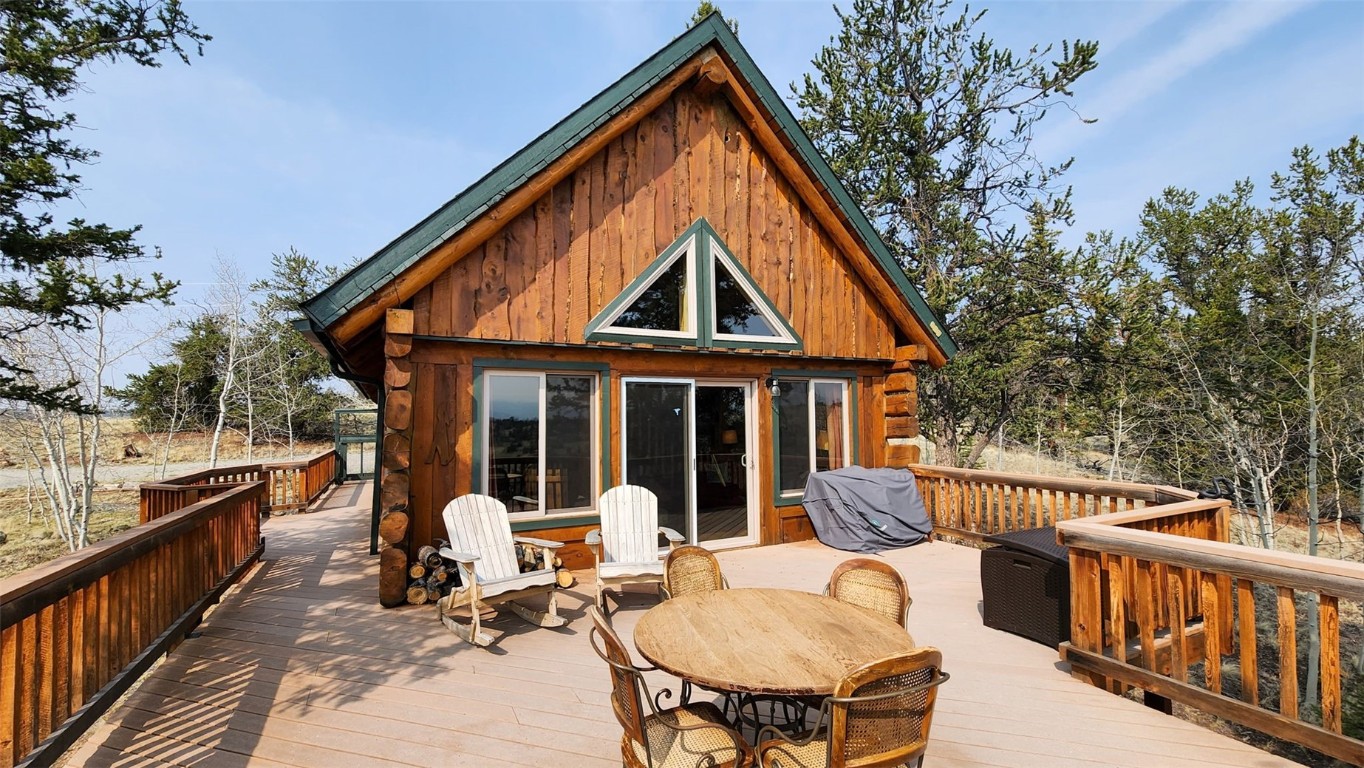 245 Bronco Circle Como, CO 80456 - Photo 32 of 40 a view of a chair and table in the balcony