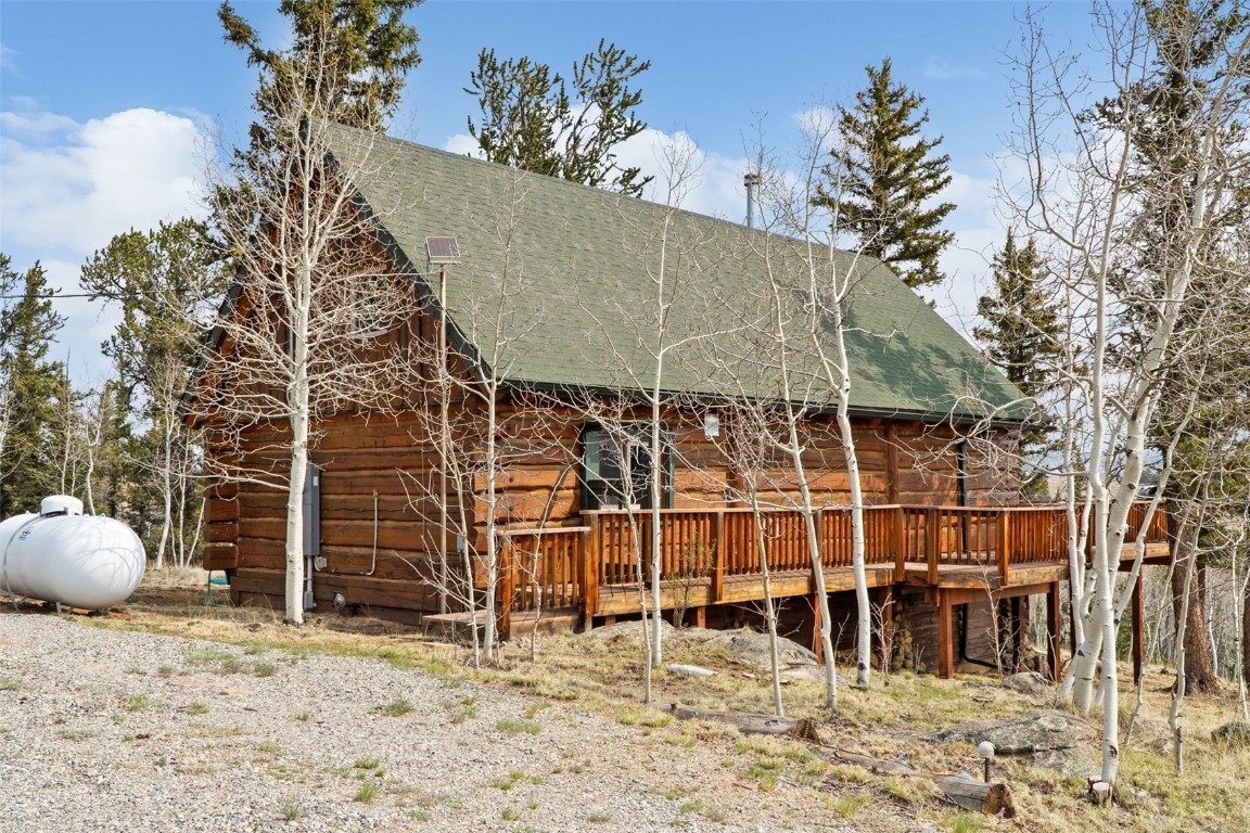 245 Bronco Circle Como, CO 80456 - Photo 37 of 40 a backyard of a house with table and chairs