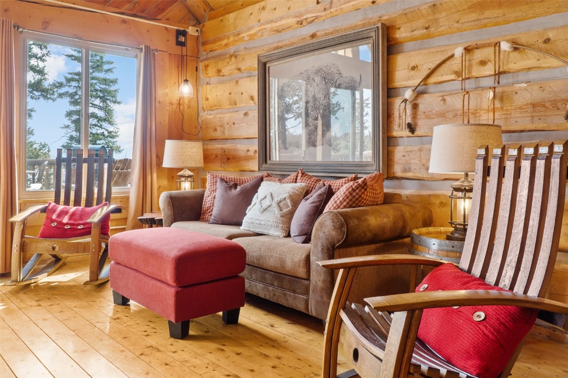 245 Bronco Circle Como, CO 80456 - Photo 6 of 40 a bedroom with furniture and a large window