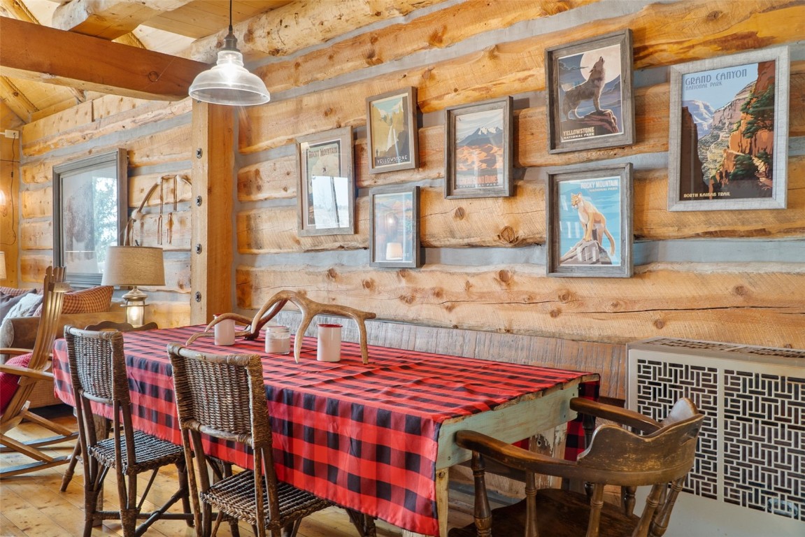 245 Bronco Circle Como, CO 80456 - Photo 10 of 40 a front view of a building with a dining table and chairs