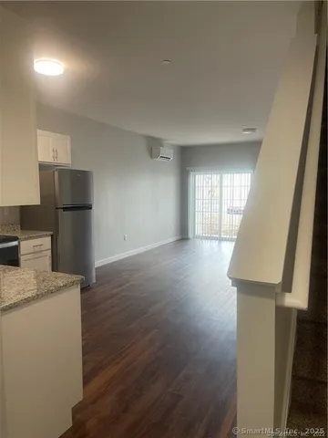 a view of a kitchen with a sink dishwasher and a refrigerator