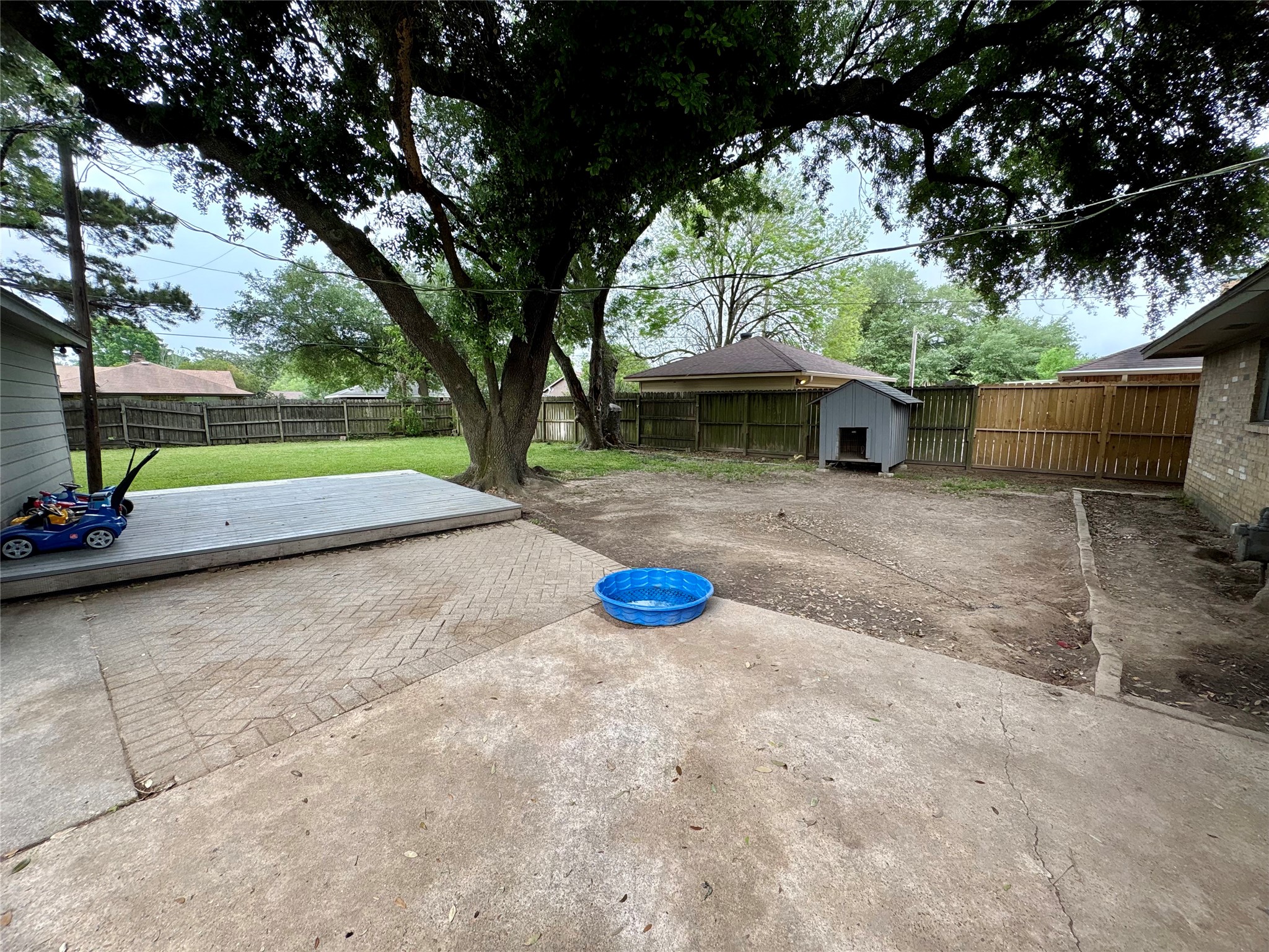 21802 Rotherham Drive Spring, TX 77388 - Photo 23 of 25 Spacious backyard with wonderful tree.
