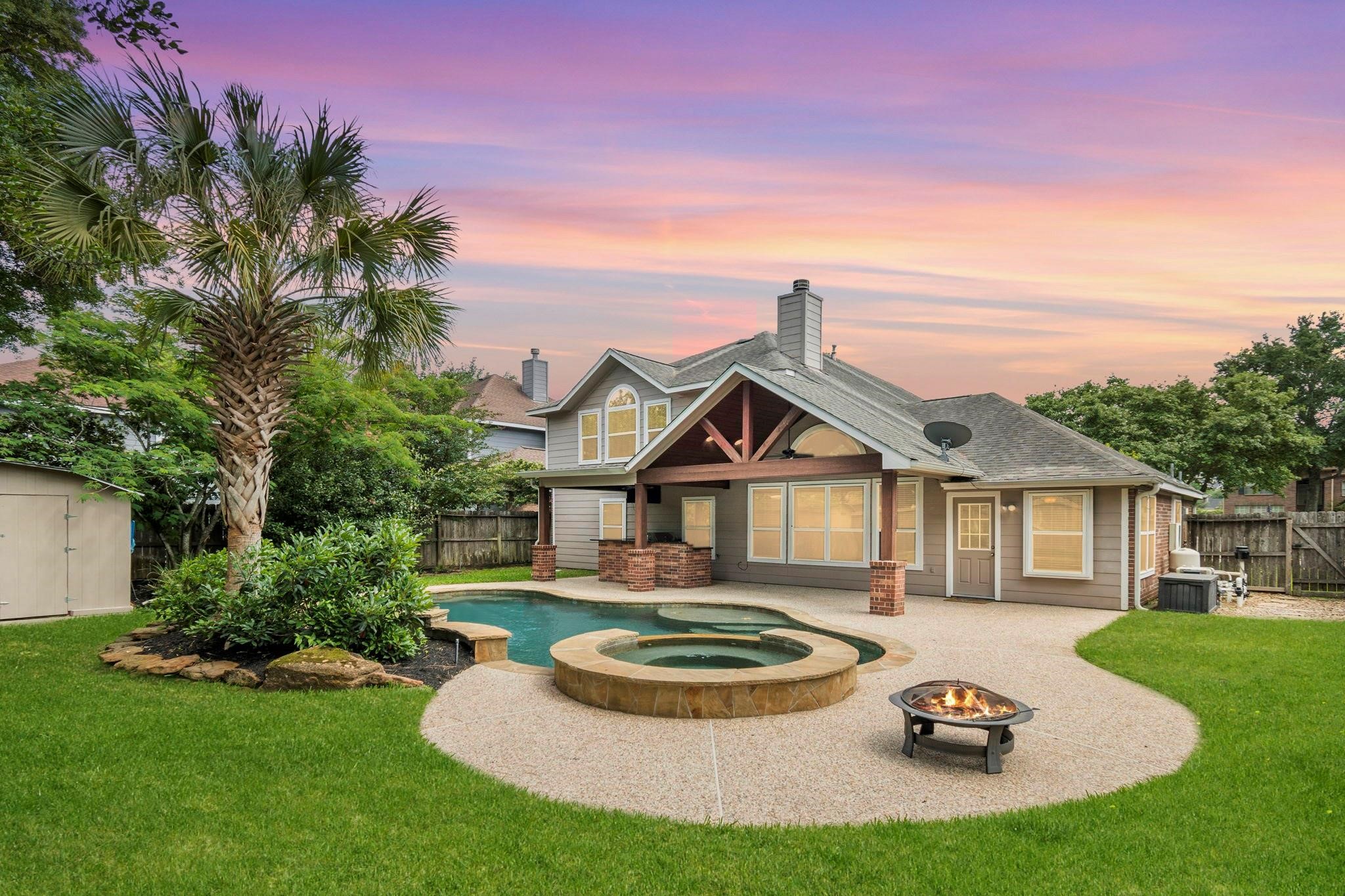 1927 Enchanted Park Drive Spring, TX 77386 - Photo 1 of 11 a front view of a house with a garden and plants