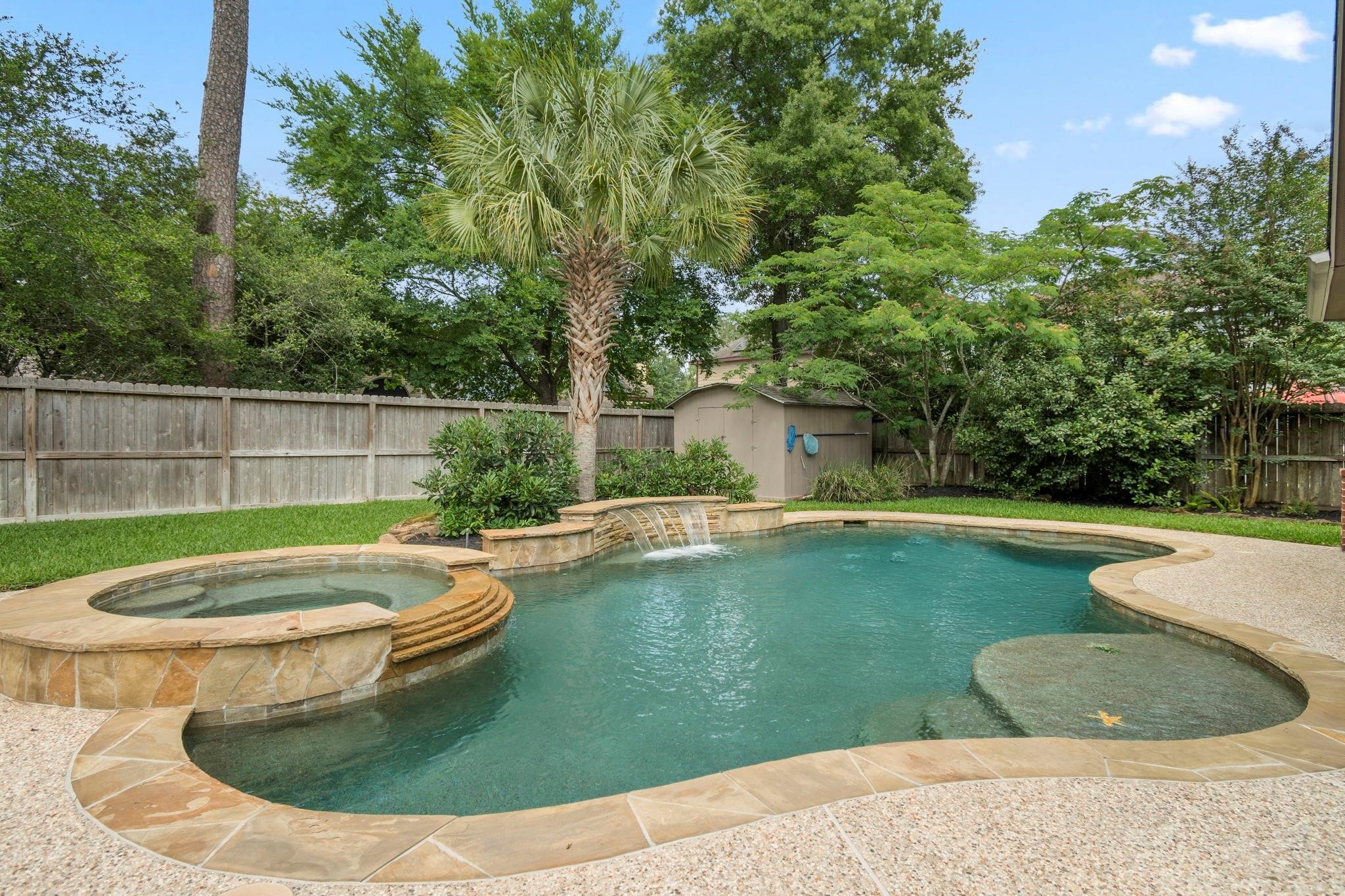 1927 Enchanted Park Drive Spring, TX 77386 - Photo 4 of 11 a view of a swimming pool with a yard