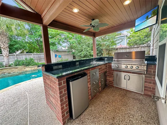 a kitchen with stainless steel appliances granite countertop a stove and a sink