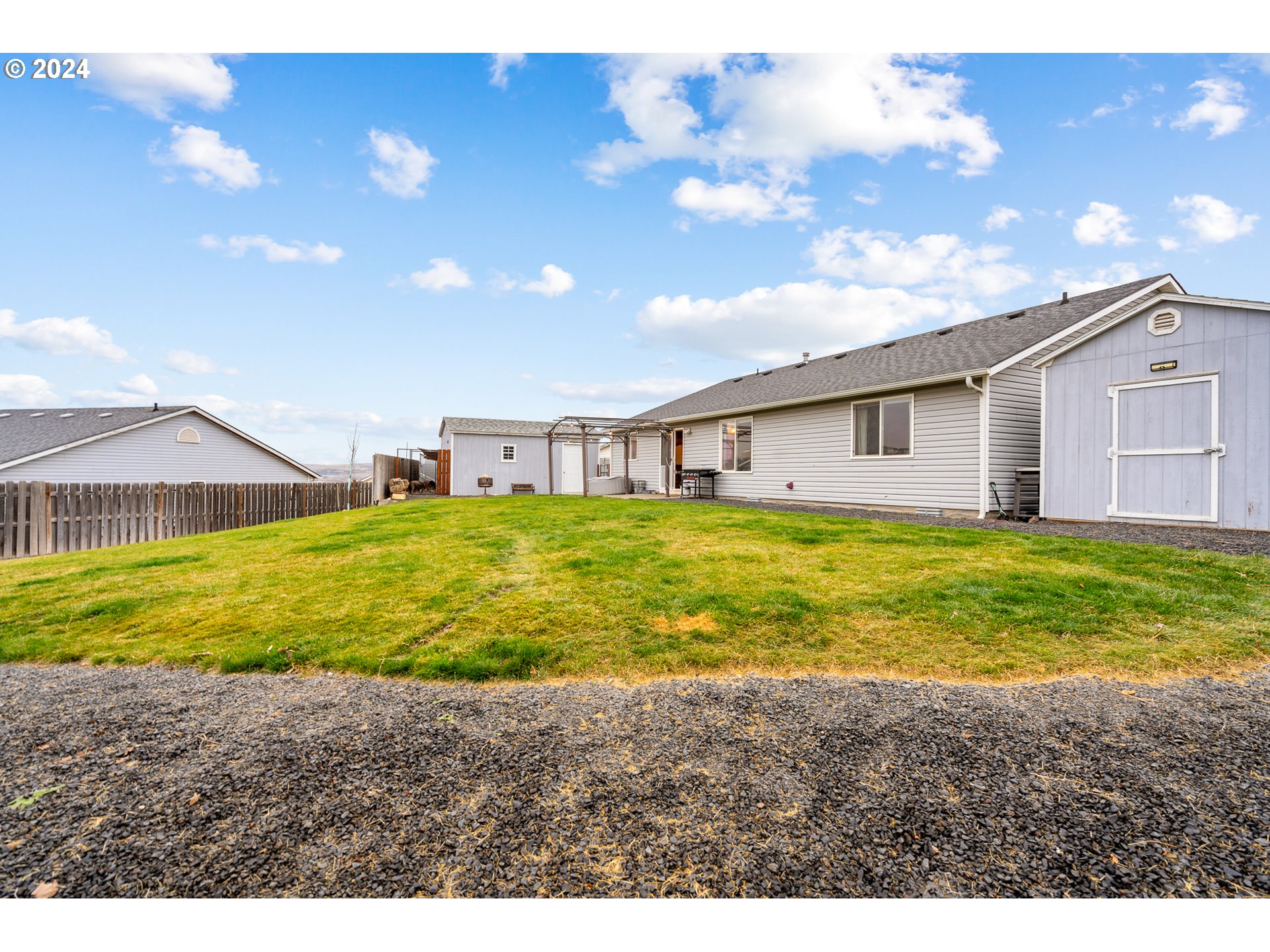 1317 Southwest 10th Court Pendleton, OR 97801 - Photo 26 of 30 a view of an house with backyard and swimming pool