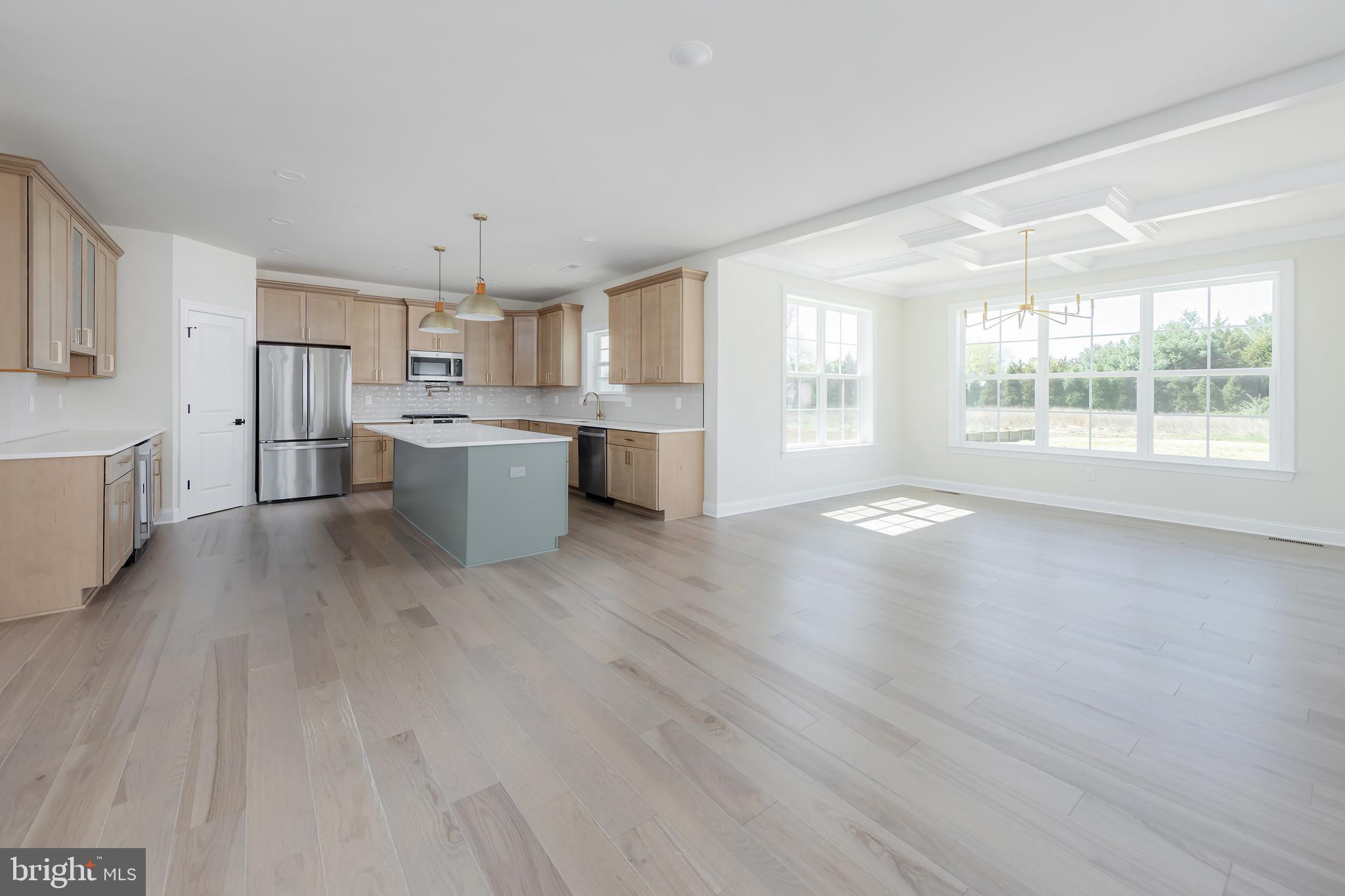 37 Whiskey Mill Road Clarksboro, NJ 08020 - Photo 11 of 33 a large white kitchen with wooden floors and a fireplace