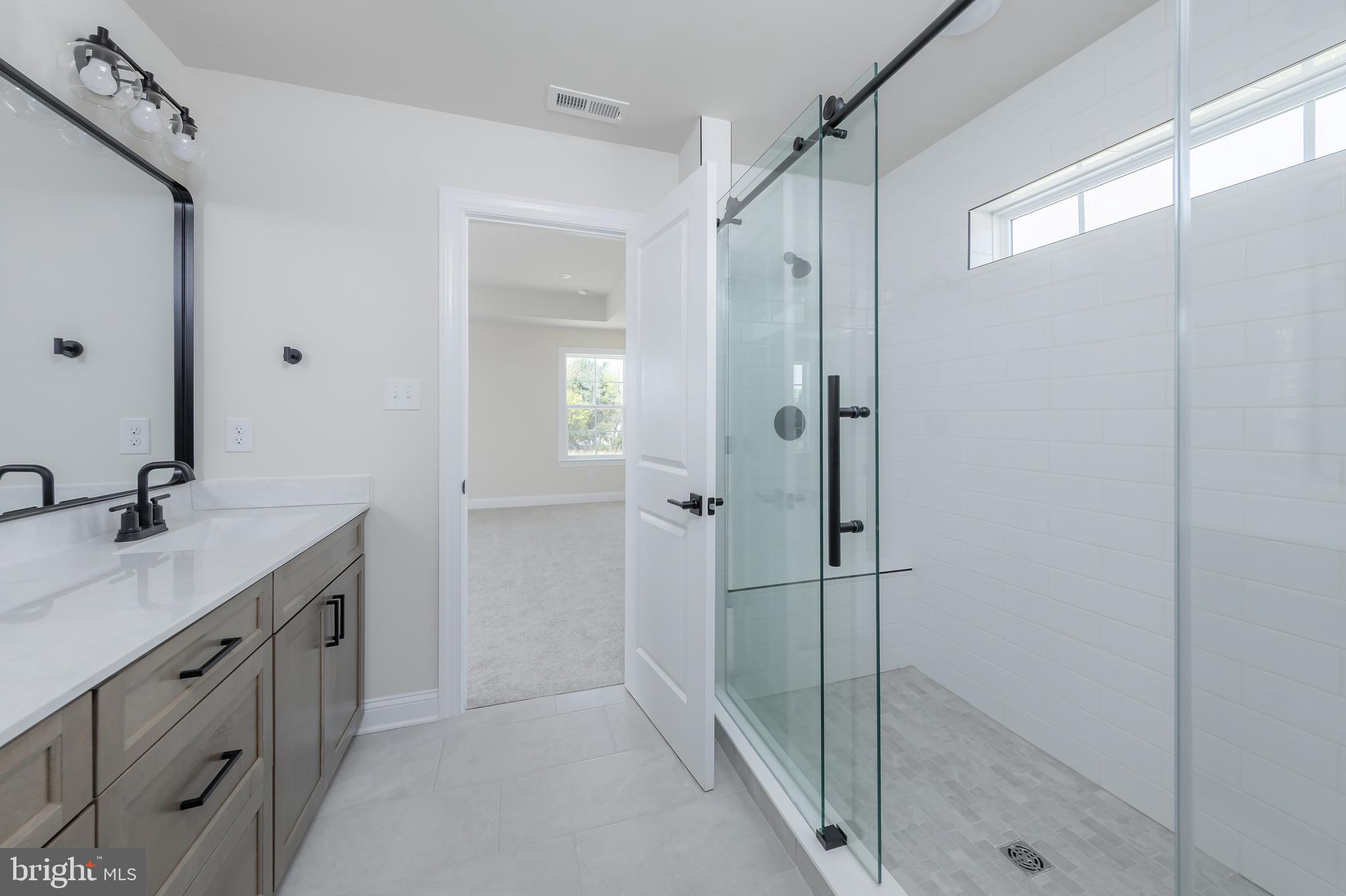 37 Whiskey Mill Road Clarksboro, NJ 08020 - Photo 21 of 33 a bathroom with a granite countertop sink mirror and shower