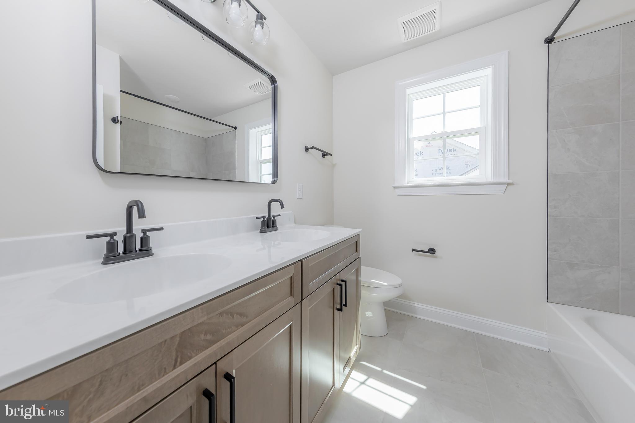 37 Whiskey Mill Road Clarksboro, NJ 08020 - Photo 25 of 33 a bathroom with a double vanity sink toilet and mirror