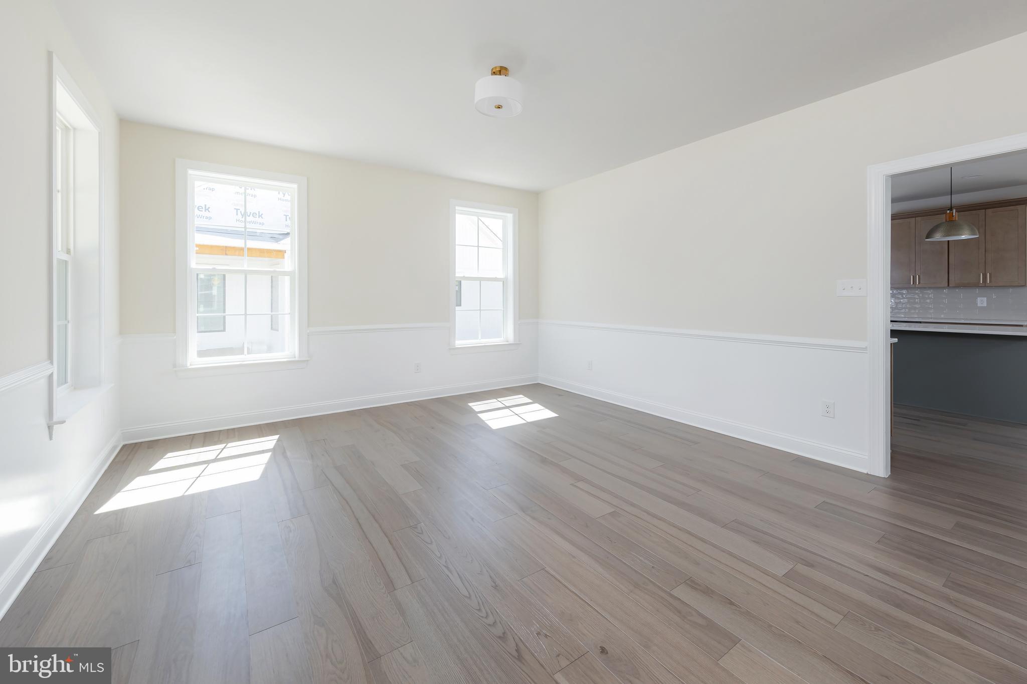37 Whiskey Mill Road Clarksboro, NJ 08020 - Photo 7 of 33 an empty room with wooden floor and windows