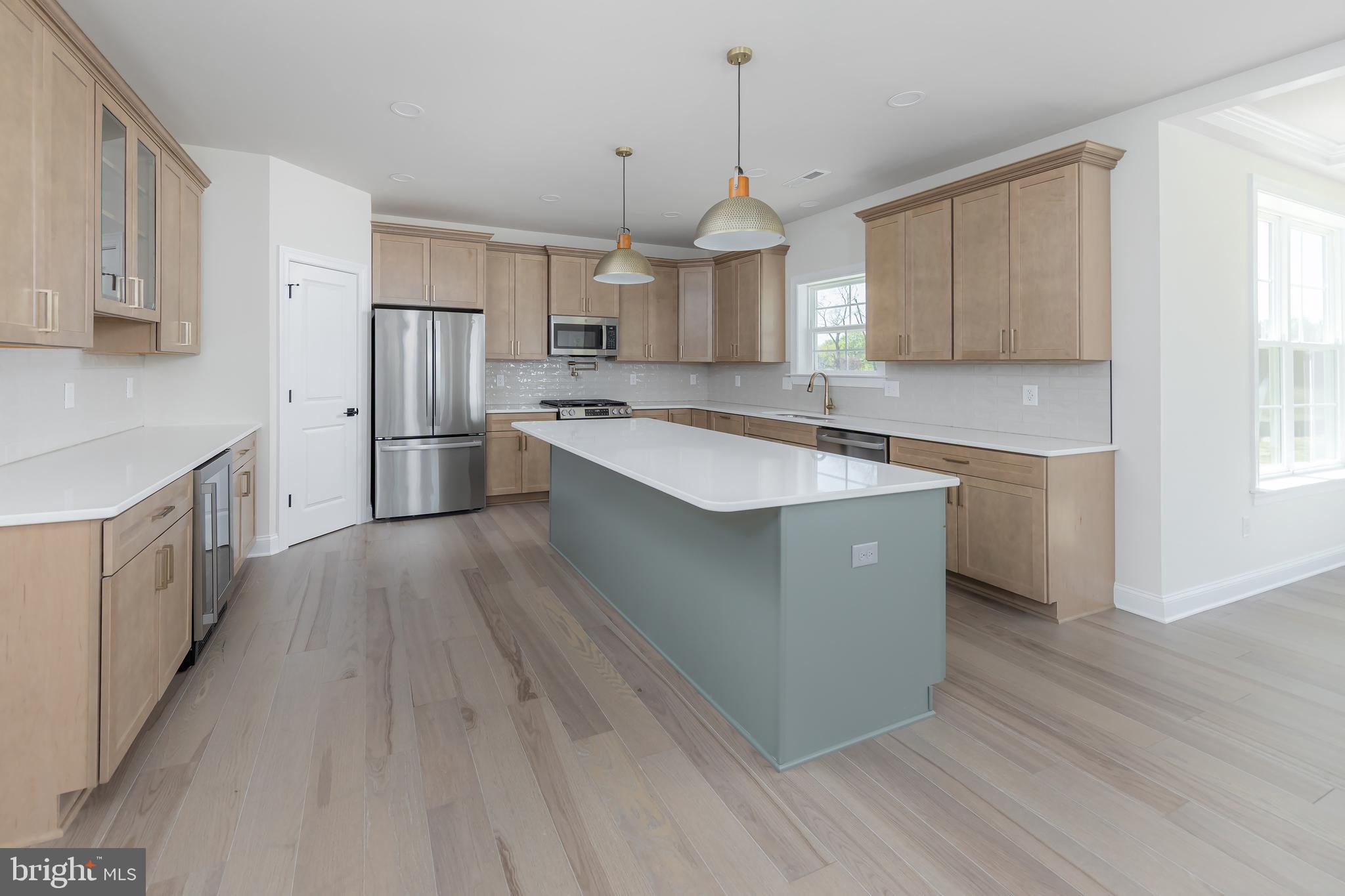 37 Whiskey Mill Road Clarksboro, NJ 08020 - Photo 8 of 33 a kitchen with stainless steel appliances granite countertop a sink a stove a refrigerator and island with wooden floor