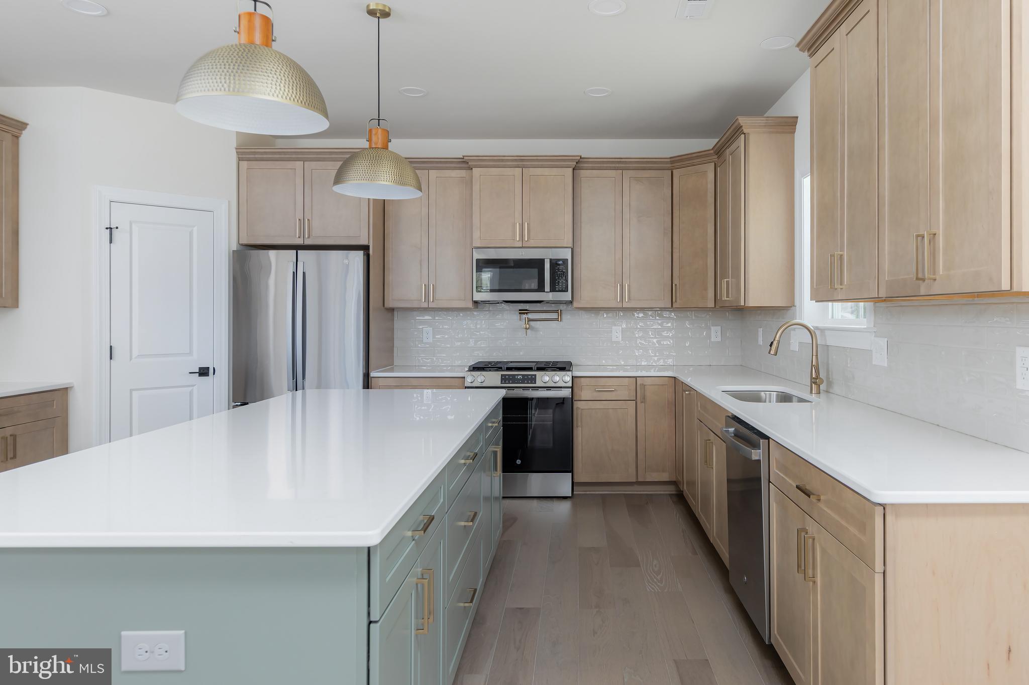 37 Whiskey Mill Road Clarksboro, NJ 08020 - Photo 9 of 33 a kitchen with a sink a stove a refrigerator and cabinets
