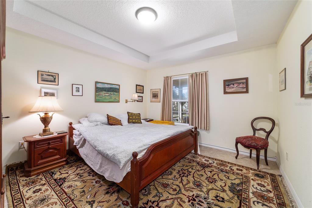 12932 Southwest 41st Place Ocala, FL 34481 - Photo 14 of 29 a bedroom with a bed and wooden floor