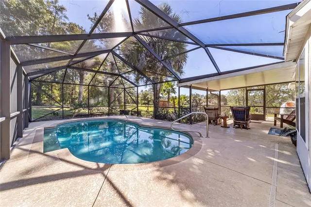 a view of a swimming pool with a patio