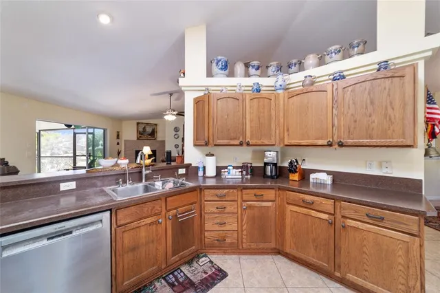 a dining room with furniture a chandelier and wooden floor