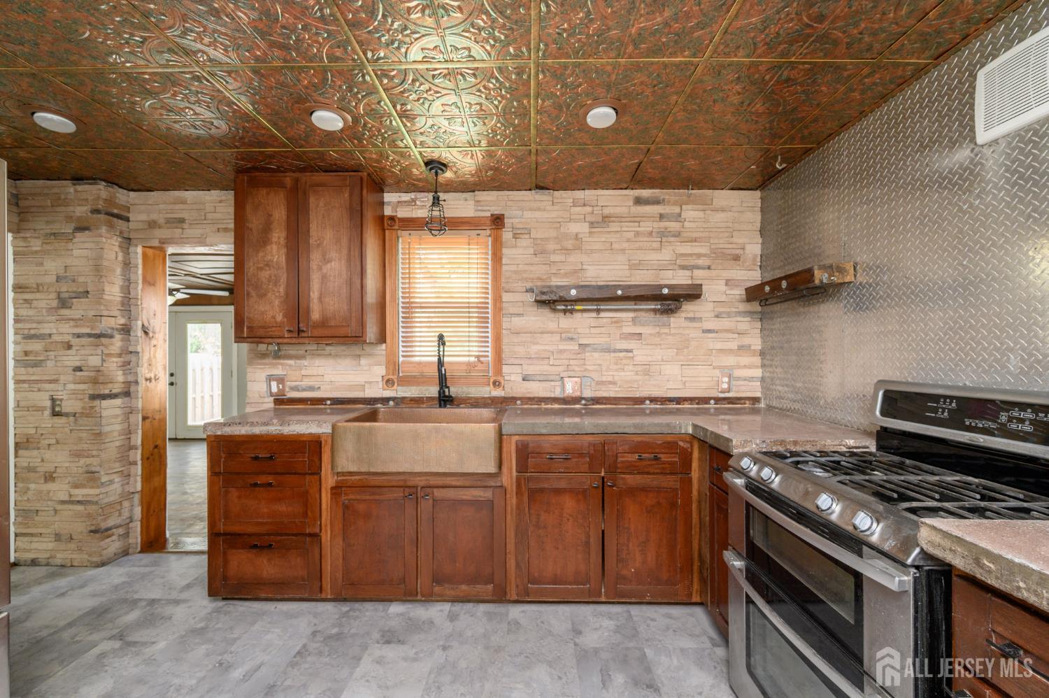 212 Echo Avenue Edison, NJ 08837 - Photo 12 of 42 a kitchen with a stove and a sink