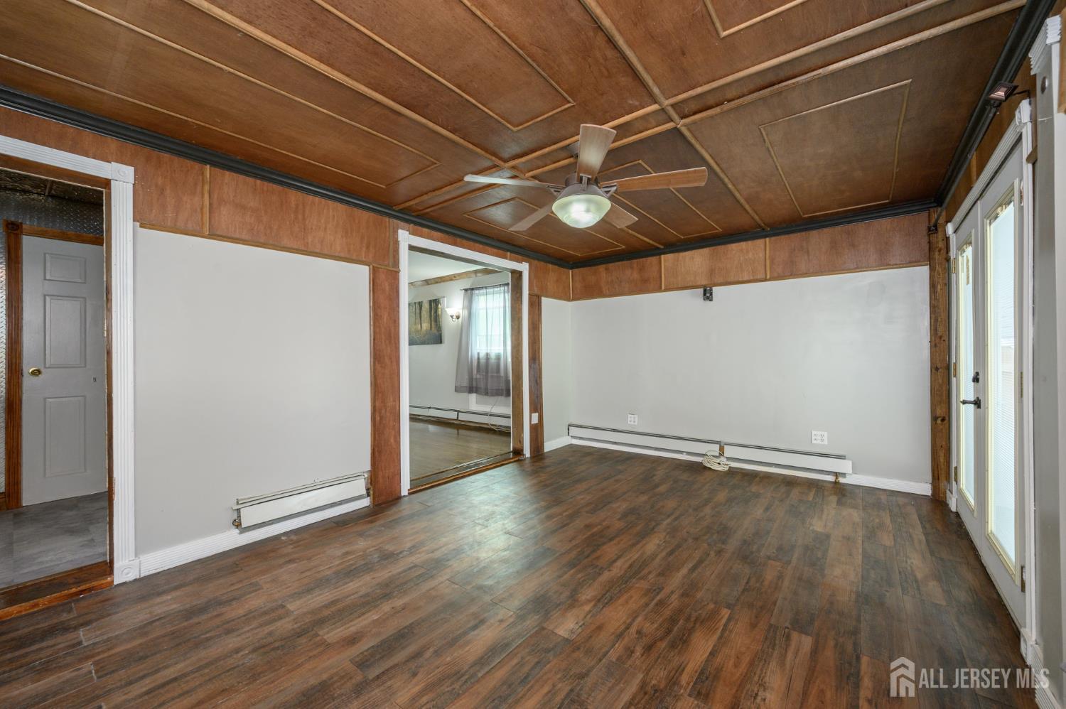212 Echo Avenue Edison, NJ 08837 - Photo 17 of 42 a view of an empty room with wooden floor
