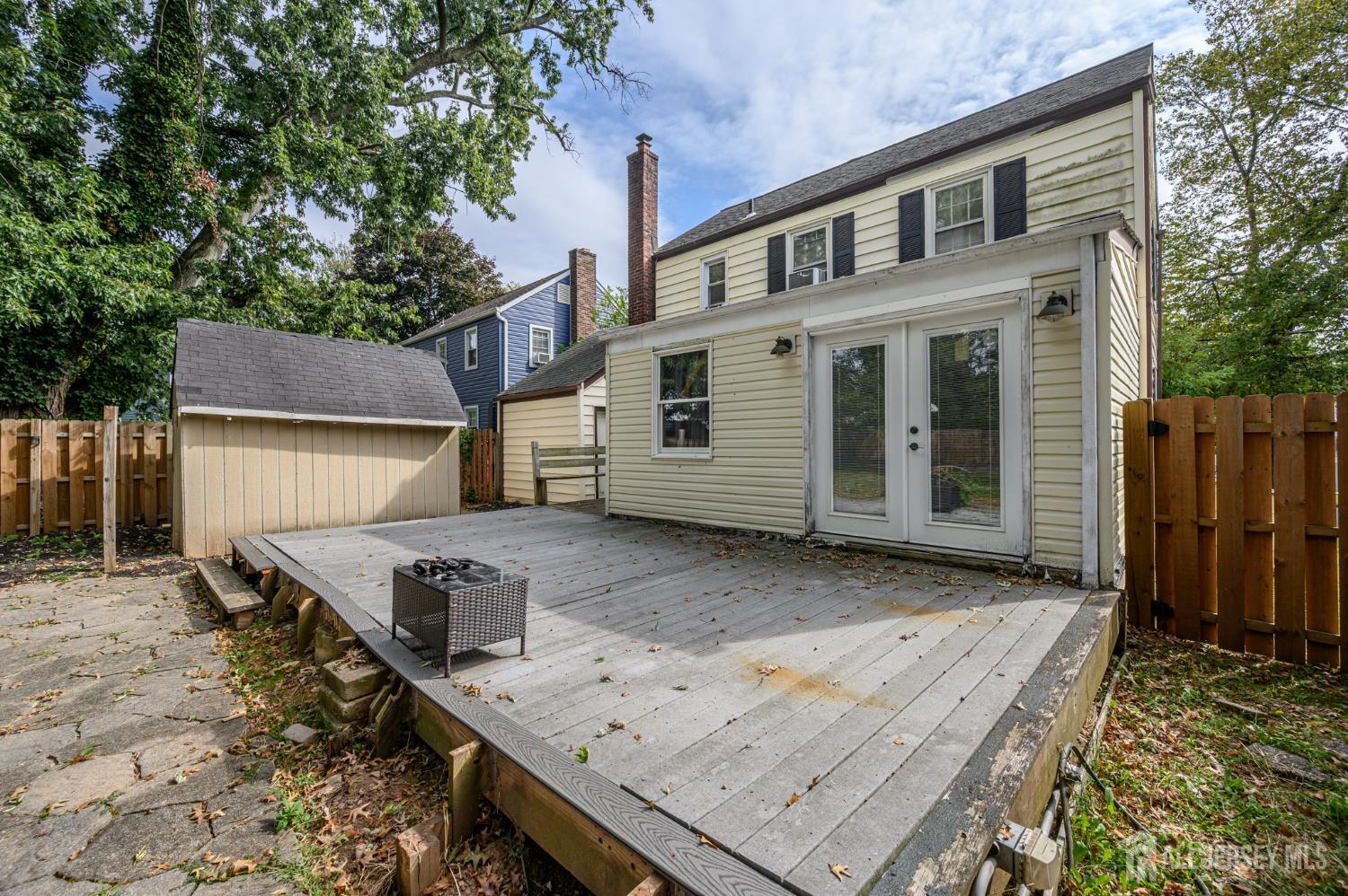 212 Echo Avenue Edison, NJ 08837 - Photo 35 of 42 a view of a wooden deck area and patio