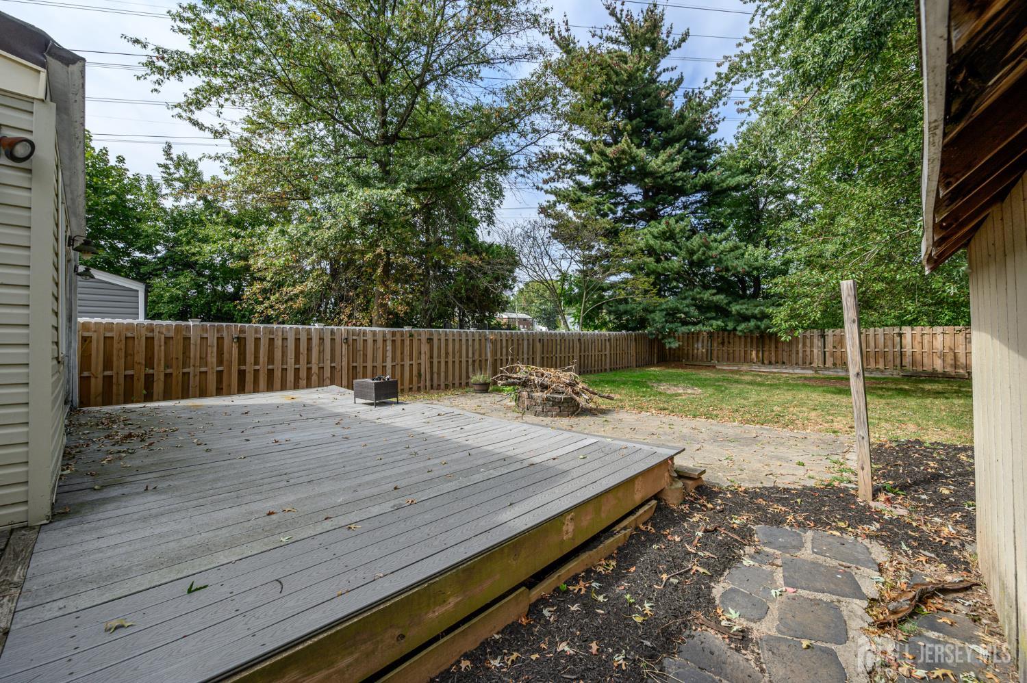 212 Echo Avenue Edison, NJ 08837 - Photo 37 of 42 a wooden bench with wooden fence