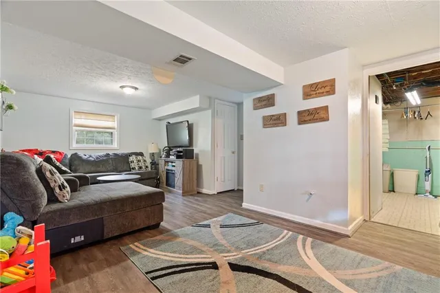 a living room with furniture and a table