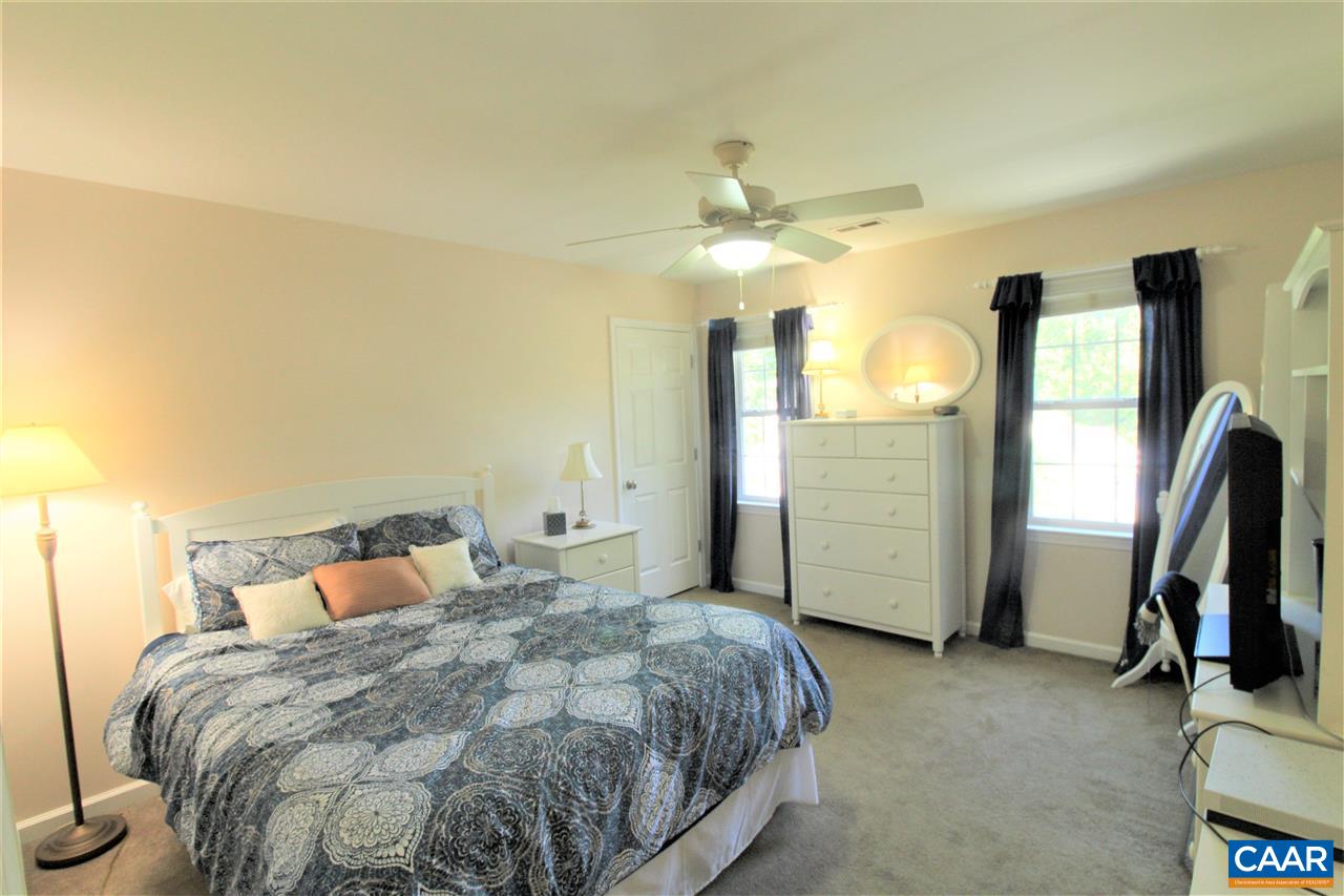 1250 Raintree Drive Charlottesville, VA 22901 - Photo 27 of 47 a bed room with a bed and a ceiling fan