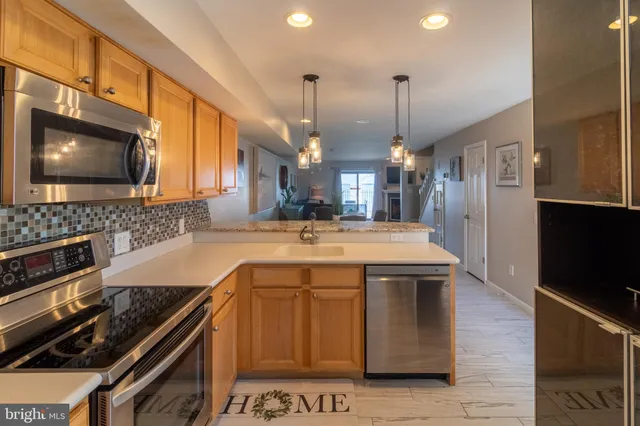 a kitchen with a stove and a microwave