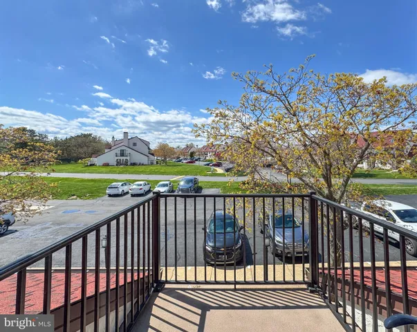 a view of a wooden deck with a yard