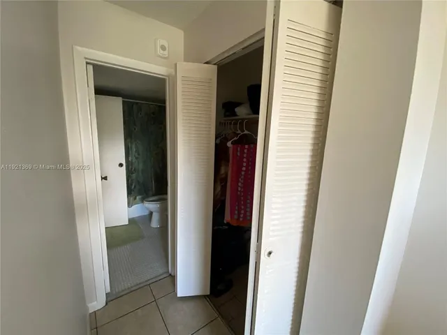 a view of a bathroom from a hallway