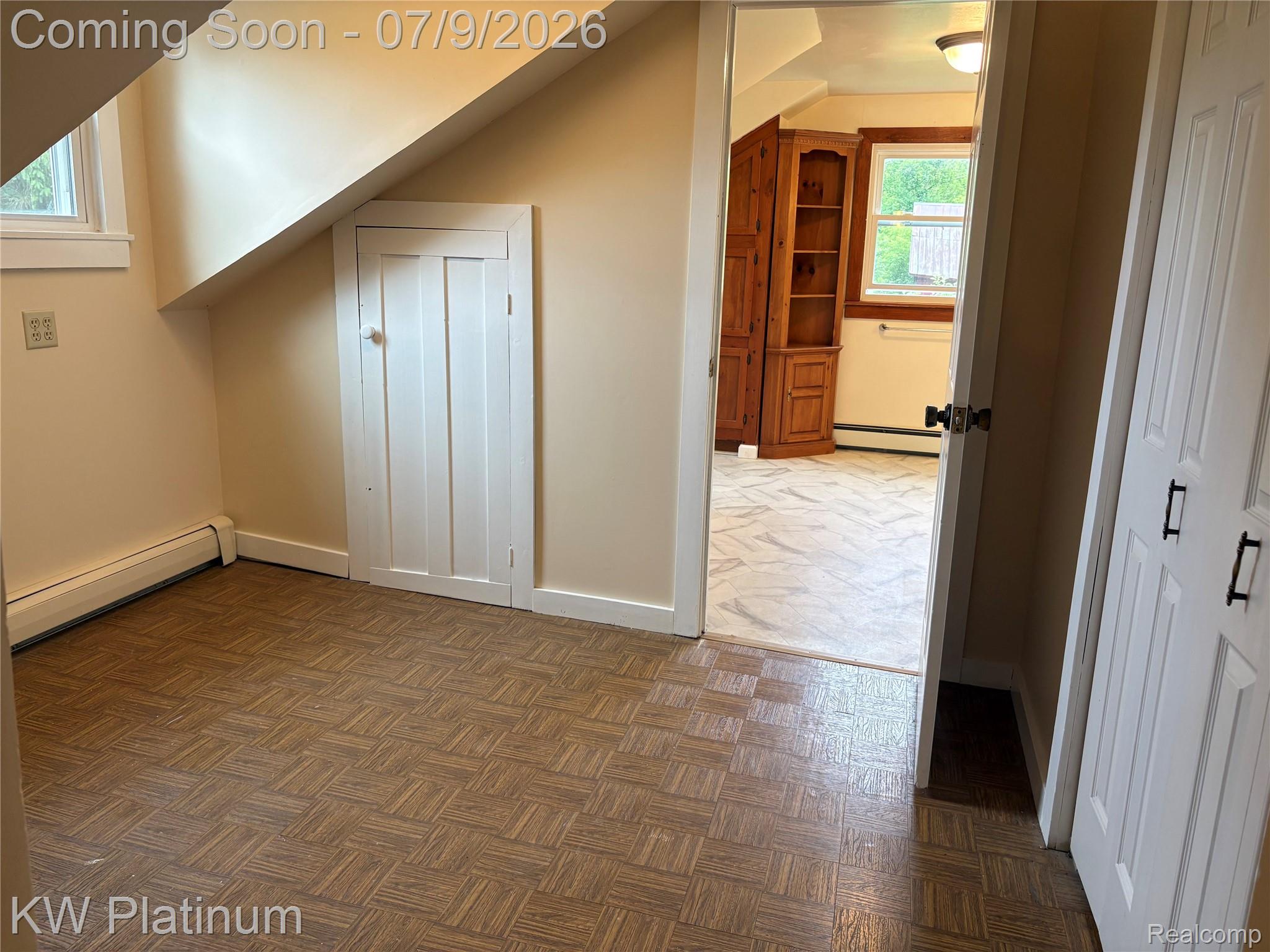 7280 North Road Fort Gratiot, MI 48059 - Photo 8 of 40 Interior room featuring patterned floor tiles, an angled ceiling, and a built-in storage door