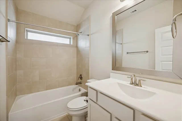 a bathroom with a sink toilet and a bathtub