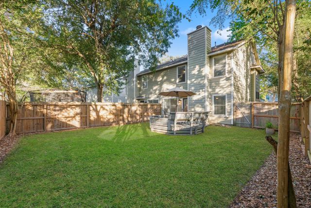 a view of a chair and table of the house
