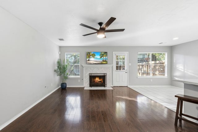 a view of a kitchen with a sink and a window