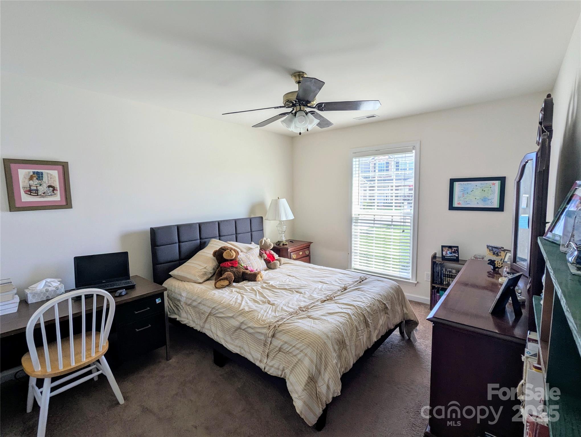 163 West Swift Creek Road Fletcher, NC 28732 - Photo 15 of 26 a bedroom with a bed and a chandelier