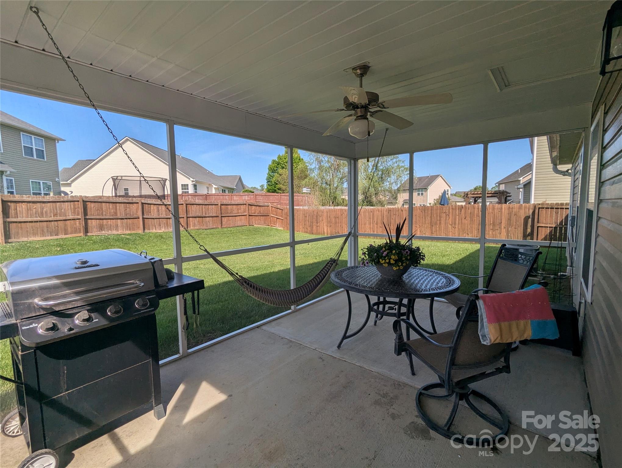163 West Swift Creek Road Fletcher, NC 28732 - Photo 19 of 26 a view of a patio with a dining table and chairs