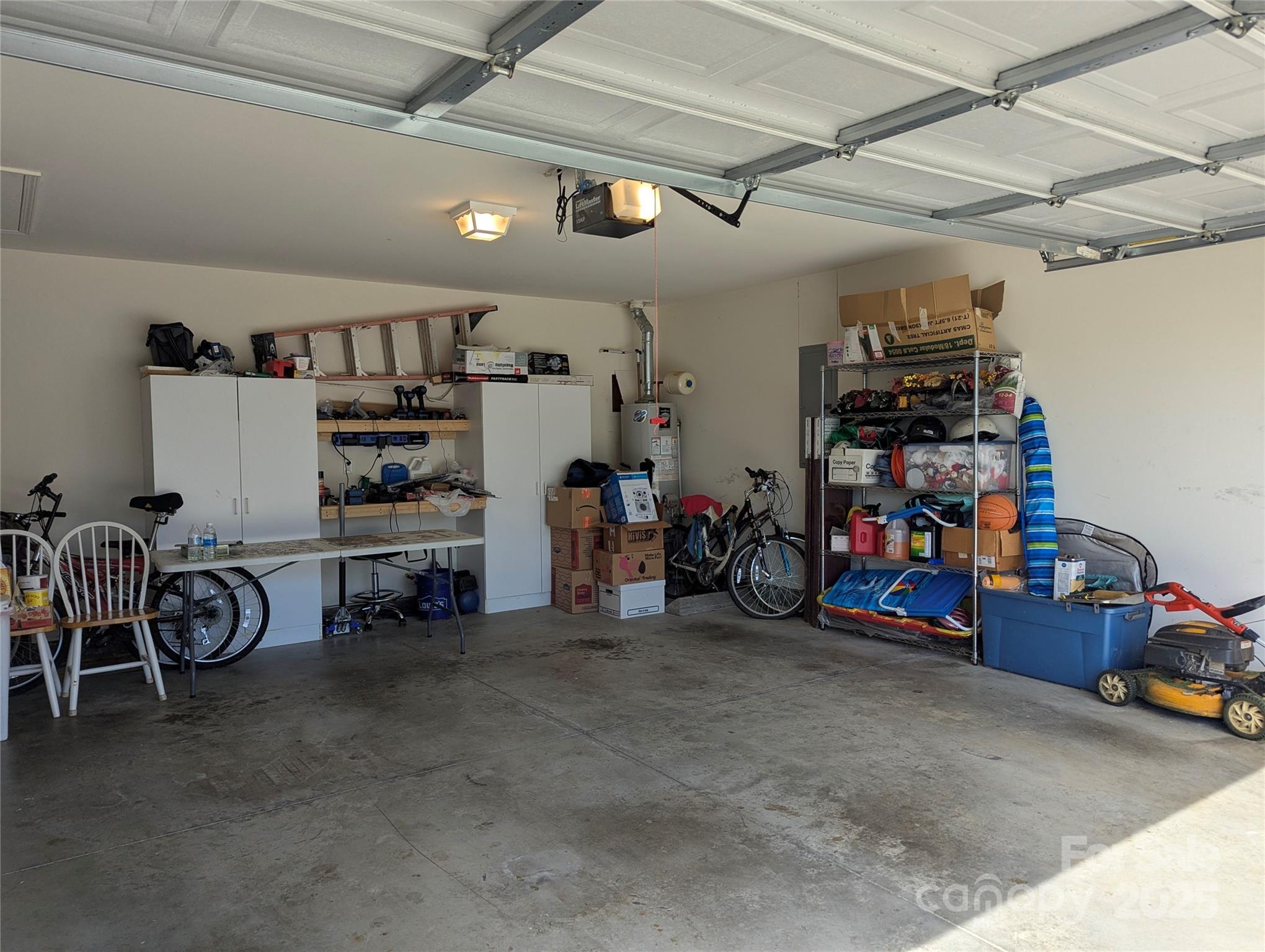 163 West Swift Creek Road Fletcher, NC 28732 - Photo 23 of 26 a view of a garage with a bike and car