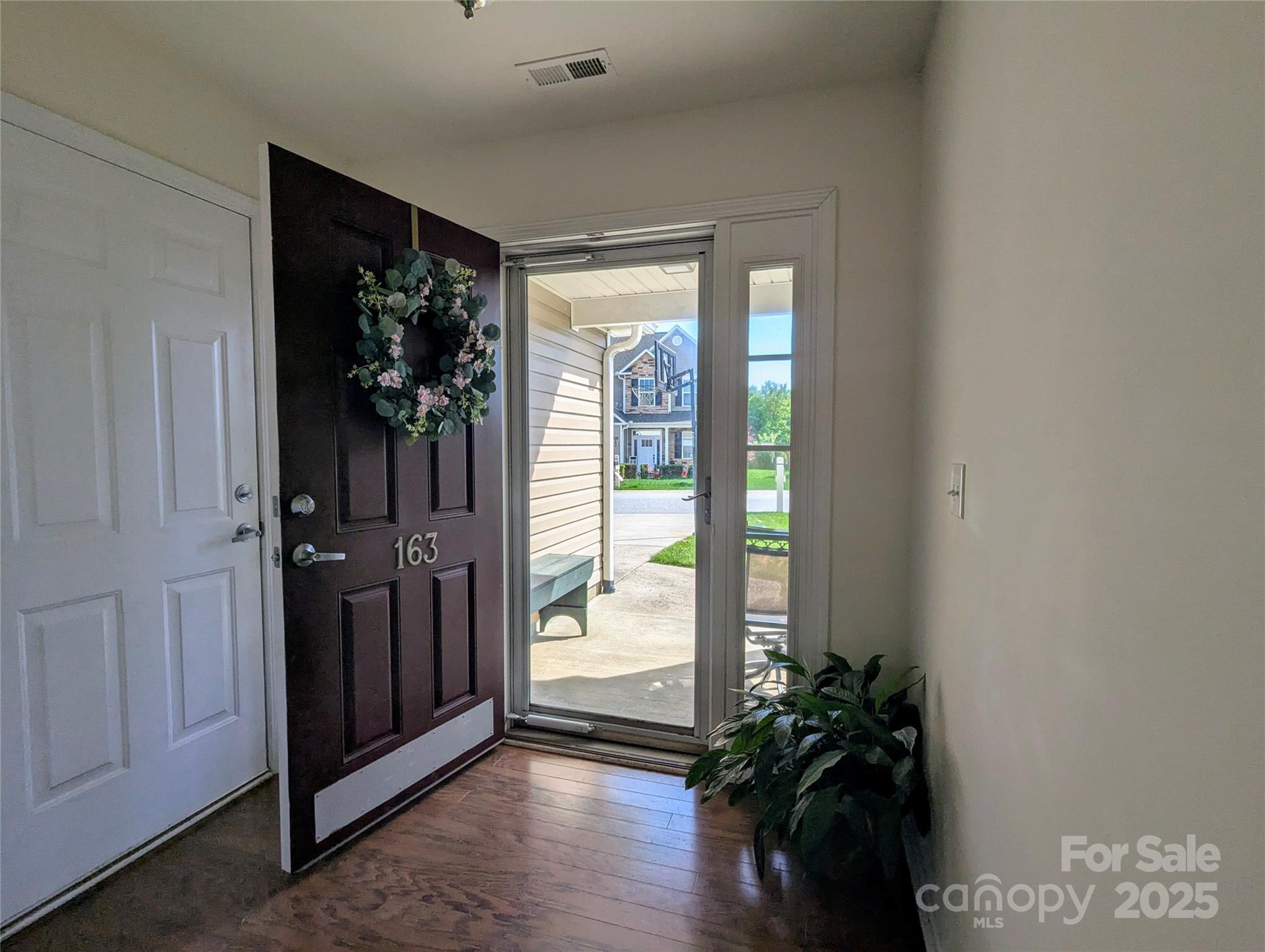 163 West Swift Creek Road Fletcher, NC 28732 - Photo 4 of 26 a view of an entryway with wooden floor