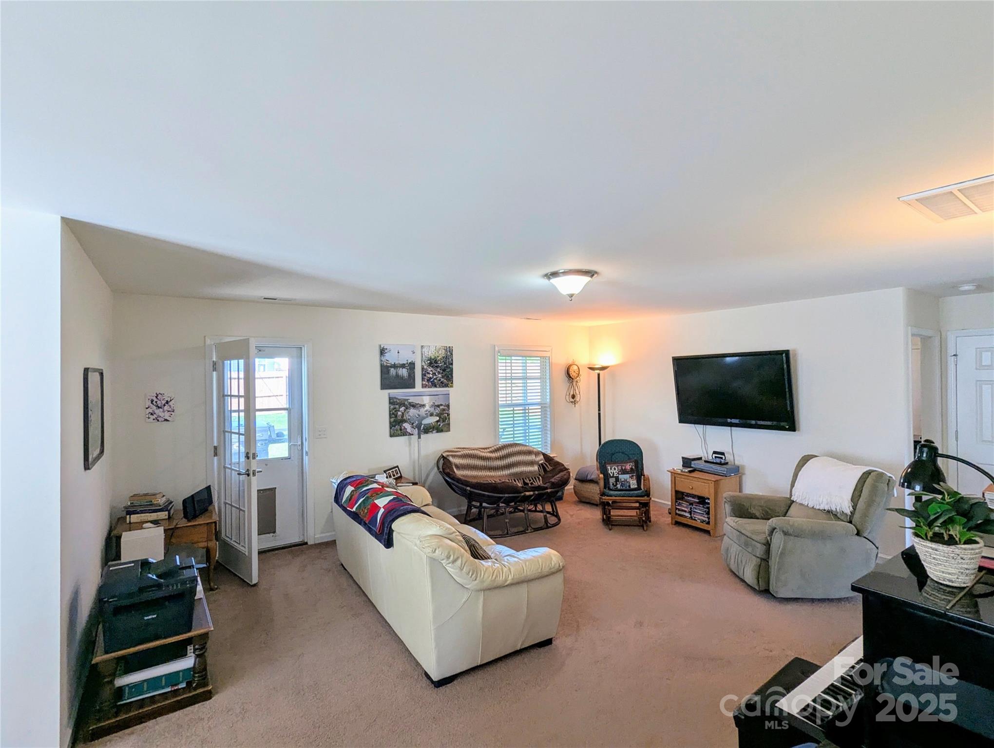 163 West Swift Creek Road Fletcher, NC 28732 - Photo 5 of 26 a living room with furniture and a flat screen tv