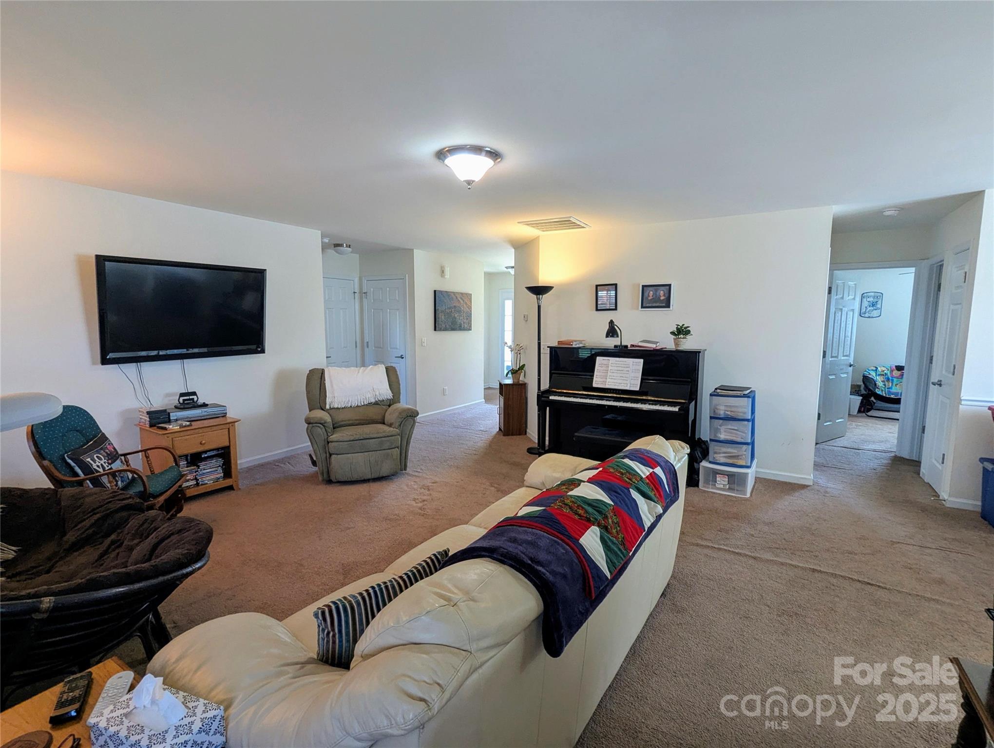163 West Swift Creek Road Fletcher, NC 28732 - Photo 6 of 26 a living room with furniture and a flat screen tv